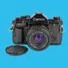 Canon® Canon A-1 Vintage SLR 35mm Film Camera With F/1.8 50mm Prime Lens 2 Canon® Canon A-1 Vintage SLR 35mm Film Camera With F/1.8 50mm Prime Lens -Camera Promotion Store canon a 1 vintage slr 35mm film camera with f1 8 50mm prime lens 1 2de1a6c1 438f 4ff2 b664 f5ad1f64fd14